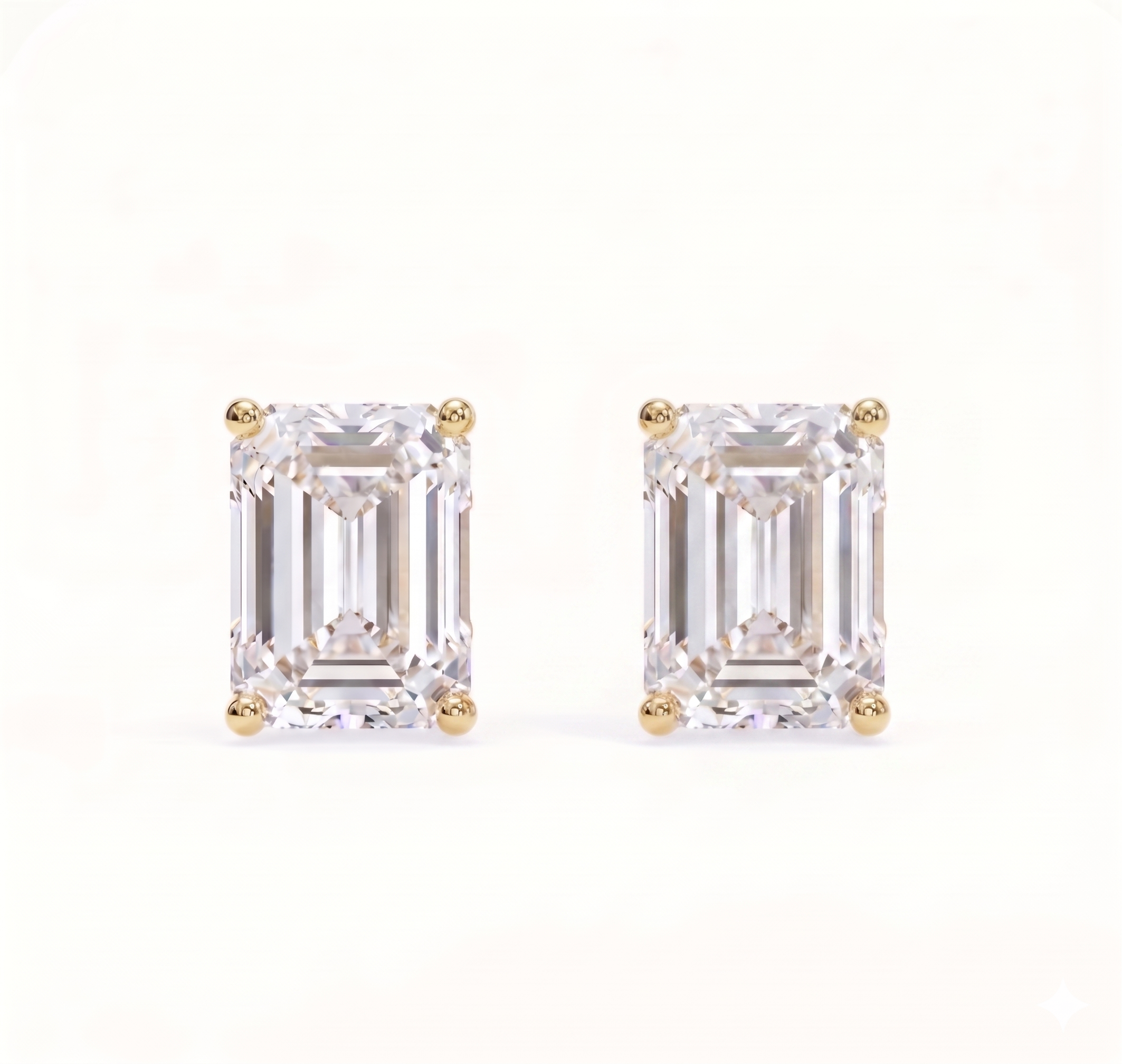 Emerald solitaire studs - Crown setting